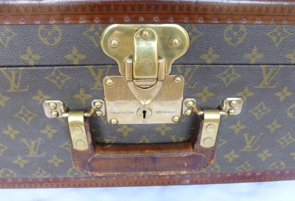 Lot - VINTAGE LOUIS VUITTON HARD-SIDED SUITCASE Exterior with